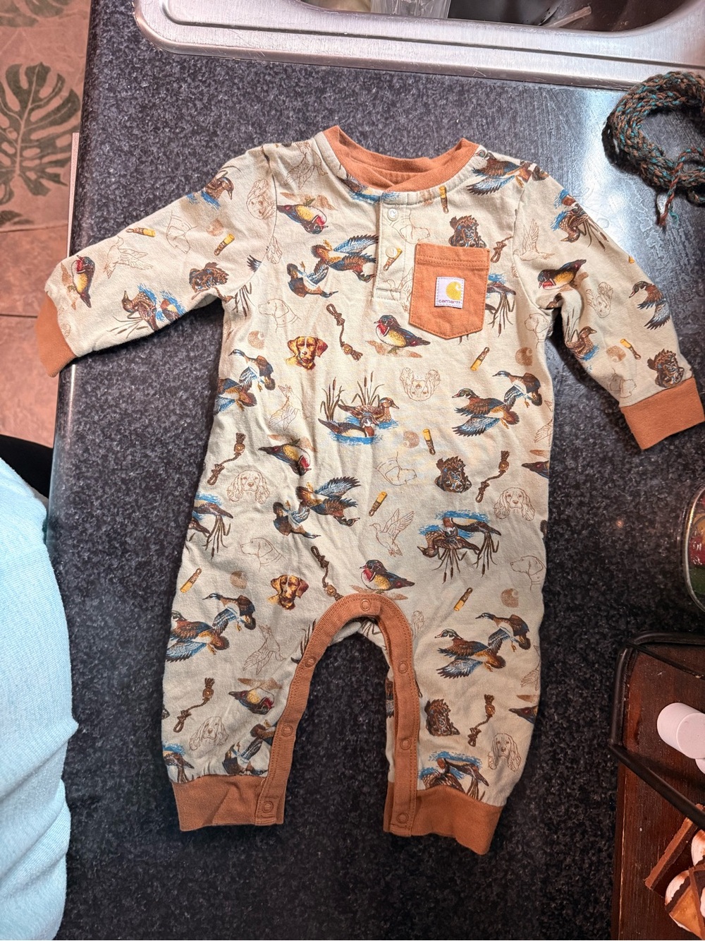 Carhartt Beige One-Piece Bodysuit with Rust Trim and Outdoor Bird Print